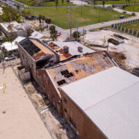 Aerial,Image,Of,A,Factory,Roof,Blown,Away,From,Hurricane